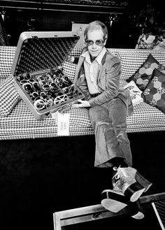 elton john with his sunglasses collection
