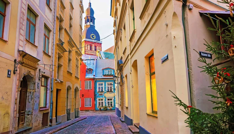 Narrow street leading to St. Peter church in Old Riga